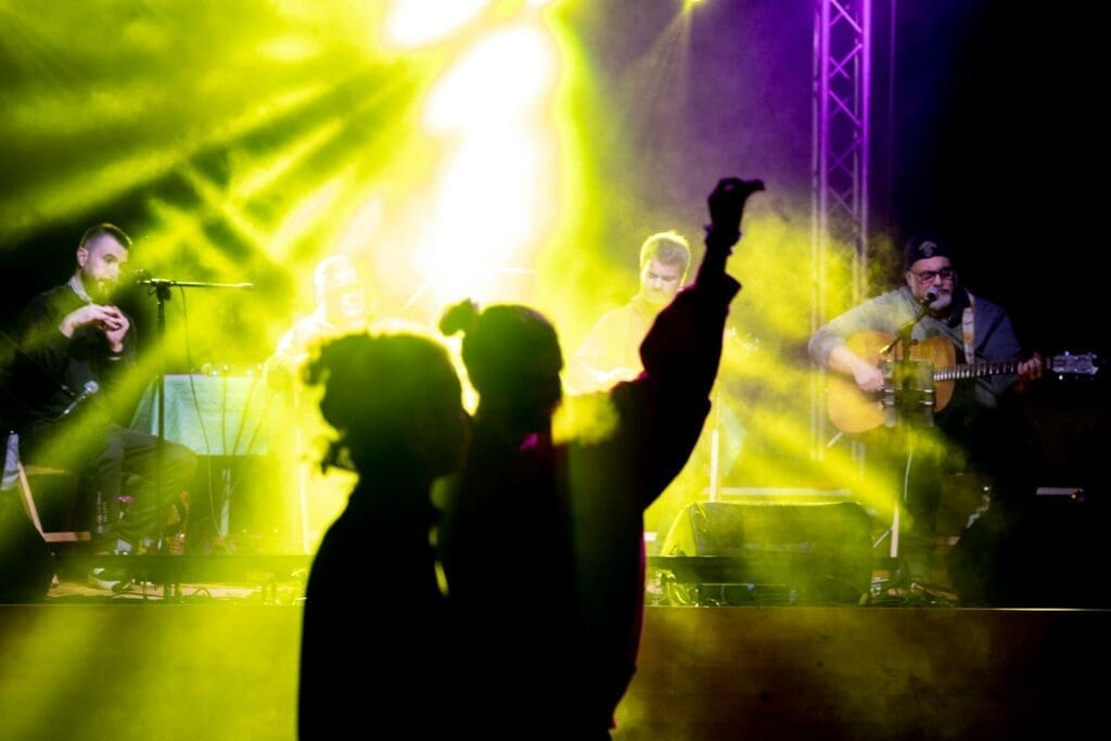 a group of people standing on top of a stage